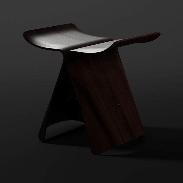 Angled view of Butterfly Stool by Yanagi Sōri in low light