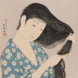 髪梳ける女